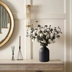 Matte Black Metal Vase with dried white florals on a wood console, modern wedding and home decor.